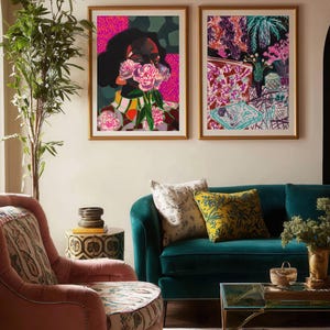 May include: Two framed rectangular art prints hanging side by side. The left print features a person holding pink flowers over their face with a vibrant pink and green background. The right print displays a colorful, abstract interior scene with plants.