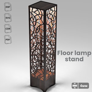 May include: A dark brown, rectangular floor lamp stand with intricate, geometric cutouts. The lamp has a square top and base, with the text "Floor lamp stand" in gray. The stand is 4mm thick.