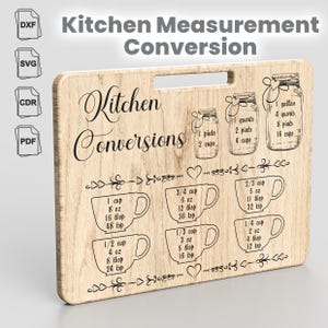 May include: A wooden chopping board with a brown wood grain pattern. The board has a handle and is engraved with the text "Kitchen Conversions". The board includes a chart of kitchen measurement conversions for cups, ounces, tablespoons, and teaspoons.
