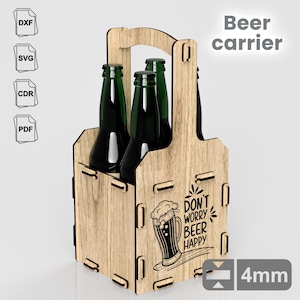 May include: Wooden beer carrier with a handle, designed to hold six bottles. The carrier is made of light brown wood and has a black graphic that says "Don't worry, beer happy".