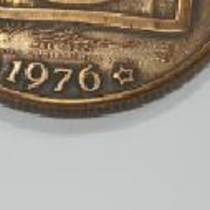 May include: Two bronze coins with different designs. The first coin features the text "Progress through Unity" and the year "1976". The second coin features the text "E Pluribus Unum" and the year "1776".