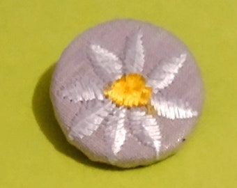 Daisy floral/ flower- Vintage 1970s repurposed  embroidered covered fabric sewing button. Lavender cotton background.