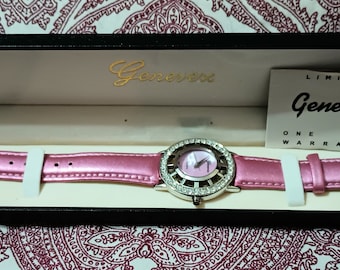 early 21st century Genevex watch. Pink leather band, rhinestones new battery included (works).