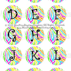 May include: A set of 15 colorful round stickers with a zebra print pattern and black letters spelling out the alphabet from A to O.  2012 Miss Priss Boutique Graphics All Rights Reserved. www.MissPrisBoutique13.etsy.com