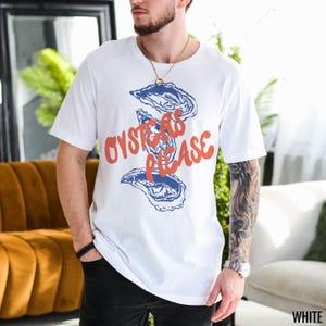 May include: White t-shirt with a graphic of oysters and the text "Oysters Please" in orange.