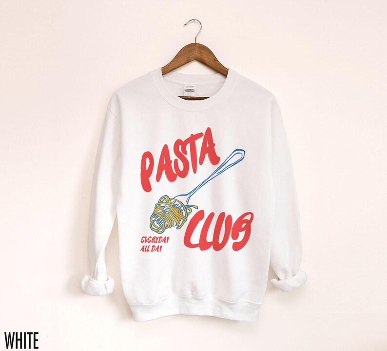 May include: White long-sleeve sweatshirt with a red and blue graphic design that says "PASTA CLUB" with a fork and noodles. The text "EVERYDAY ALL DAY" is below the graphic.