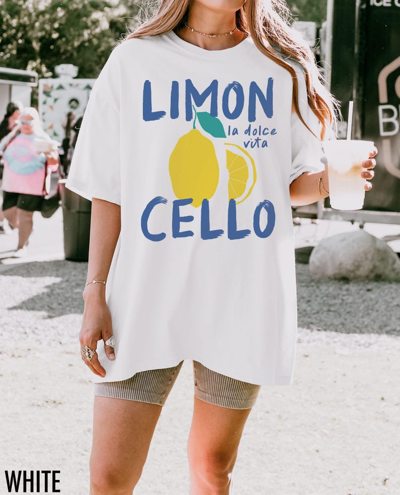 May include: White oversized t-shirt with a blue graphic of a lemon and the text "Limon Cello la dolce vita".