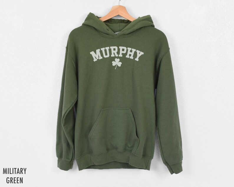 May include: A green hooded sweatshirt with the word "MURPHY" in white lettering and a white shamrock design.