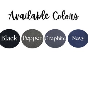 May include: Image showing the text "Available Colors" in a cursive font. Underneath are four circular colour swatches labelled "Black", "Pepper", "Graphite", and "Navy". The swatches are set against a white background.