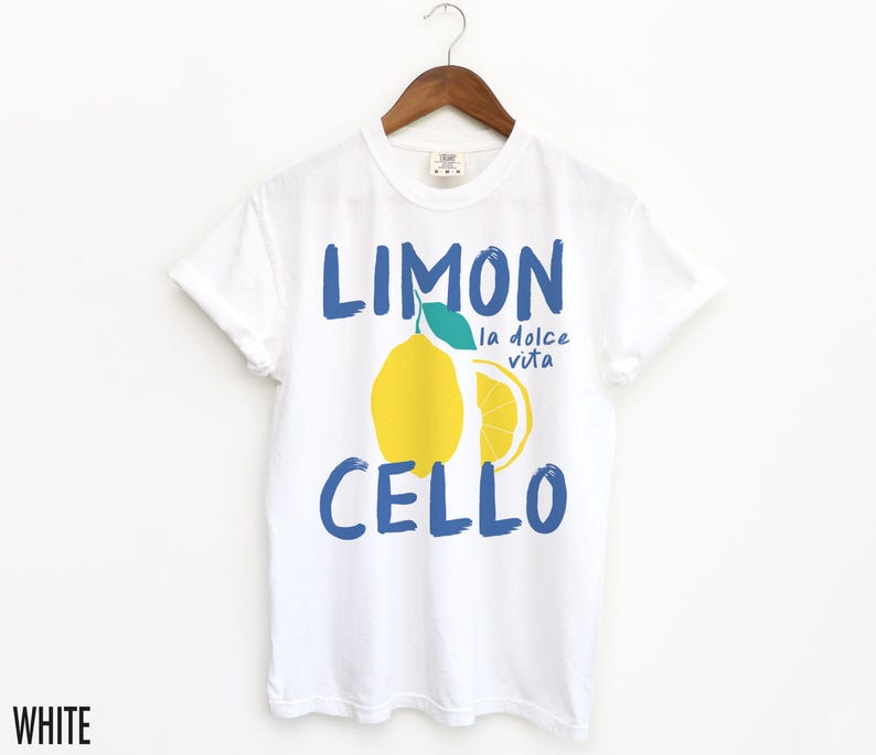 May include: White t-shirt with a blue and yellow graphic of a lemon with the text "Limon Cello" and "la dolce vita" in blue.