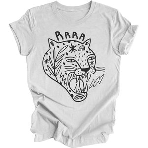 May include: A white t-shirt with a black and white illustration of a roaring tiger with the word "RAWR" above it.