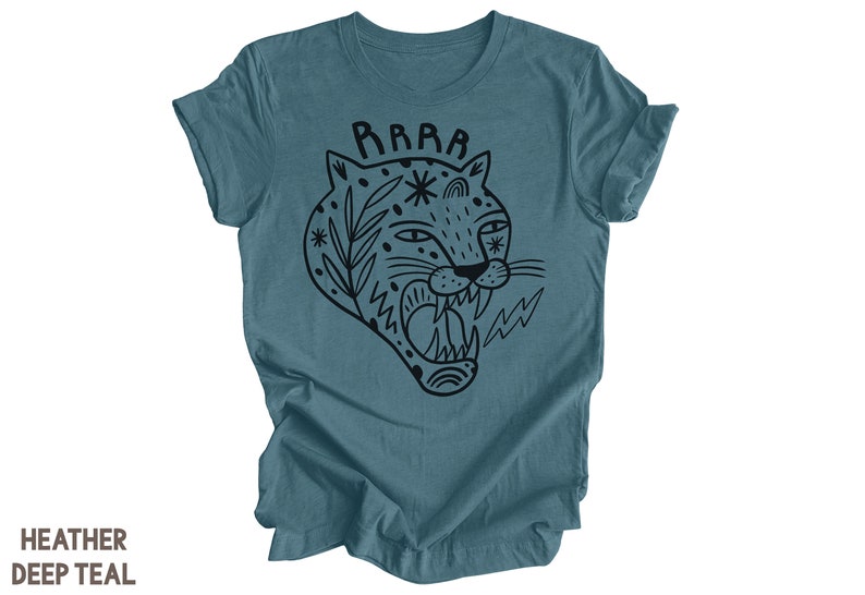 May include: A heather deep teal t-shirt with a black and white illustration of a roaring tiger's head with the word "RRRR" above it.