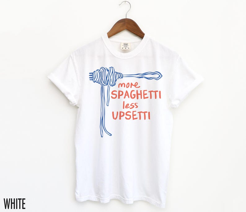 May include: White t-shirt with a blue and red graphic of a fork and spaghetti with the text "more spaghetti less upsetti".