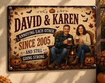 May include: A rectangular metal sign with a distressed cream background featuring the text DAVID & KAREN ANNOYING EACH OTHER SINCE 2005 AND STILL GOING STRONG. The design includes illustrations of pumpkins, autumn leaves, and bats.