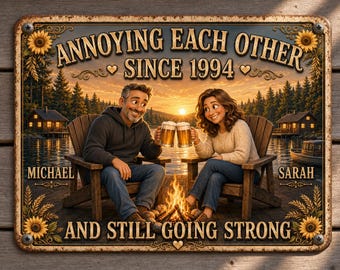 May include: A rectangular metal sign featuring a couple sitting in wooden chairs by a campfire at sunset, holding beer mugs. The text reads: ANNOYING EACH OTHER SINCE 1994, MICHAEL, SARAH, AND STILL GOING STRONG. The border is decorated with sunflowers.