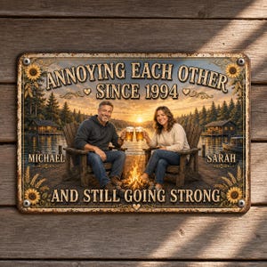 May include: A rectangular metal sign featuring a couple sitting in wooden chairs on a dock by a lake at sunset, holding beer mugs. The text reads: ANNOYING EACH OTHER SINCE 1994, MICHAEL, SARAH, AND STILL GOING STRONG. The border is decorated with sunflowers.