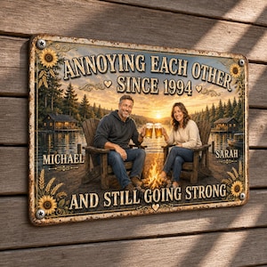 May include: A rectangular metal sign featuring a lake scene with a couple sitting in chairs by a fire, holding beer mugs. The text reads: ANNOYING EACH OTHER SINCE 1994, MICHAEL, SARAH, AND STILL GOING STRONG. The sign has a rustic, weathered border.