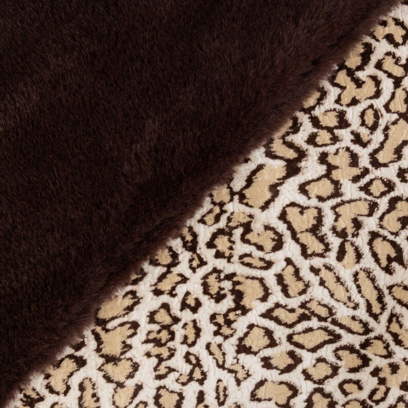 May include: A diagonal split image showcasing two distinct textures. One side features a plush, dark brown faux fur, while the other displays a cream-colored fabric with a brown leopard print pattern. The contrast highlights the different textures.