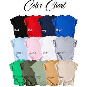 May include: A color chart displaying thirteen short-sleeve t-shirts in various colors including black, red, navy, royal blue, light blue, light pink, white, sport gray, Irish green, military green, sage, old gold, and sand, with labels for each.