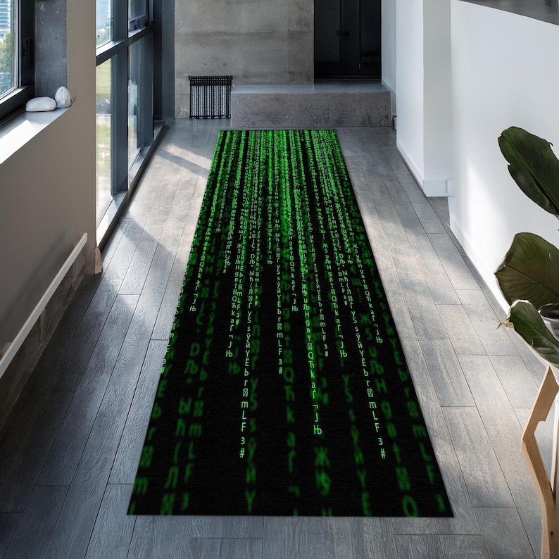 May include: A black and green runner rug with a repeating pattern of green code on a black background.