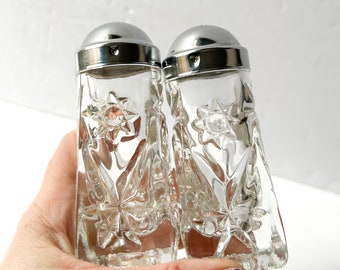 Vintage glass salt and pepper shakers with celestial sun and star design, Anchor Hocking