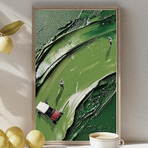 Könnte beinhalten: Gerahmter Kunstdruck mit abstraktem Motiv. Das Bild zeigt eine strukturierte grüne Landschaft mit einem rot-weißen Spielzeugauto und zwei kleinen Figuren. Das Kunstwerk hat einen modernen, minimalistischen Stil mit Fokus auf Farbe und Form.