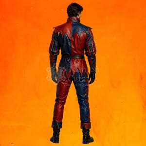 May include: A full-body leather suit featuring a split red and blue color scheme. The garment includes a high collar, long sleeves, a dark belt at the waist, and pointed hem details on the shoulders and jacket base. Black gloves and boots complete the outfit.