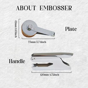 May include: A silver metal embosser with a handle and a plate. The plate is 1.65 inches tall and 5.74 inches wide. The handle is 4.72 inches wide.