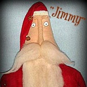 May include: A handmade felt Santa Claus doll with a long white beard, red suit, and a red hat with a white pom-pom. The doll has a long nose, large eyes, and a friendly expression. The doll is labeled "Jimmy".
