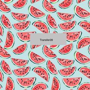 May include: A repeating pattern of watermelon slices on a light blue background. The watermelons are red with black seeds and green rinds. The text "Transfer28" is in a gray rectangle.
