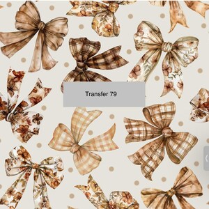 May include: A seamless pattern featuring brown and beige bows with floral and plaid designs on a cream background with brown polka dots. The text "Transfer 79" is in the center of the image.