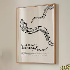 May include: Framed art print featuring a black and white illustration of two shofars, traditional Jewish ram's horn instruments. The artwork includes the text "Speak Unto The Children Of Israel" and a biblical verse.