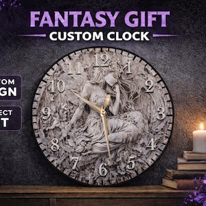 May include: A custom clock with a fantasy theme. The clock face features a detailed relief of a seated angel with wings. The clock hands are gold-colored. The words "FANTASY GIFT CUSTOM CLOCK" are at the top. A lit candle and purple roses are in the background.