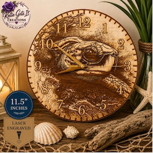 May include: A laser-engraved wooden clock featuring a detailed sea turtle design. The clock face is 11.5 inches in diameter, with gold-colored hands and numerals. The clock is surrounded by seashells and driftwood, evoking a coastal theme.