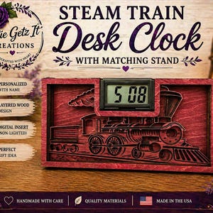 May include: A red wooden desk clock with a steam train design and a digital display showing 5:08. The clock is in a matching stand and has the text "STEAM TRAIN Desk Clock" on it. The clock is handmade in the USA.