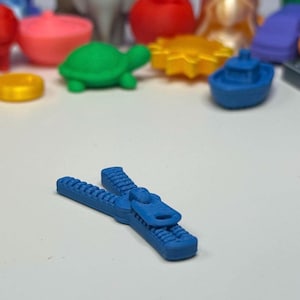 Mini Blue Zipper  – Mini Object for Storytelling, Pretend Play & Speech Therapy | Talkets™