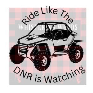 May include: Black and white graphic of an off-road vehicle with the text "Ride Like The DNR is Watching." The vehicle has large tires and is set against a red and black plaid background with a forest silhouette.