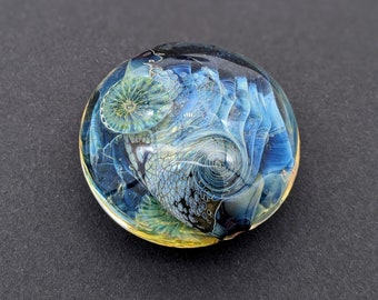 Lentil shaped glass bead