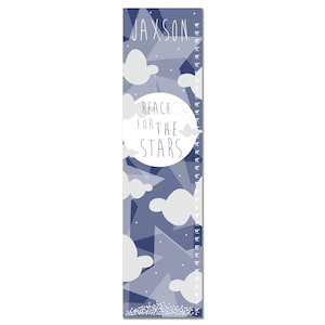 May include: A blue and white growth chart with a moon and stars design. The chart features the text "Reach for the Stars" and a personalized name, "Jaxson".