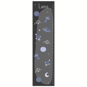 May include: A black and gray growth chart with a space theme. The chart features a rocket, planets, stars, and a UFO. The chart is labeled "Luna" and has a measurement scale in inches.