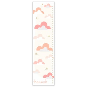May include: A pink and white cloud-themed growth chart with gold stars and the name "Hannah" at the bottom. The chart measures height in inches from 24 to 60 inches.