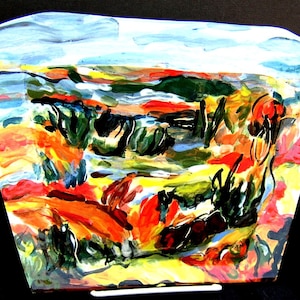 May include: Abstract landscape painting on a glass panel. The painting features a mix of bright colors, including red, orange, yellow, green, and blue. The painting is framed in a clear glass frame.