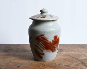 Handmade Ceramic Lidded Jar, 6.25 inches high, Matte Lavender Glaze with Red Swirls