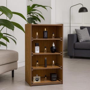 May include: A wooden display shelf with four levels, showcasing various perfume bottles. The shelf is a warm brown colour, and the bottles are in different shapes and sizes, with black, clear, and white labels. The shelf is in a modern living room setting.