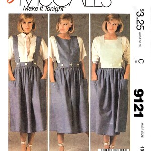 May include: McCall's sewing pattern featuring a blue denim jumper with large pockets and button details. The pattern includes three different jumper styles, with the text "Easy McCall's Make It Tonight" at the top. The pattern is size 10.
