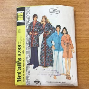 May include: A McCall's 3738 sewing pattern envelope for a robe, featuring illustrations of four individuals wearing different robe styles. The yellow side panel displays the text McCall's 3738, size small 30-32 bust/chest, and extra carefree.
