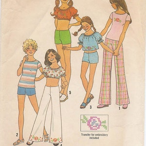 May include: A sewing pattern for girls' clothing, Simplicity pattern number 7511, size 10. The pattern includes four different outfits: a pink and white plaid pants and a pink top with a floral design, a white top with a floral design and white pants, a blue and white gingham top and shorts, and a green top and shorts. The pattern is labeled "Simple-to-Sew" and is for stretch knits only.