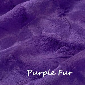May include: A vibrant purple faux fur fabric with a dense, soft, and plush texture. The surface features deep folds and ripples that create natural shadows and highlights across the material. The text "Purple Fur" is printed in white.