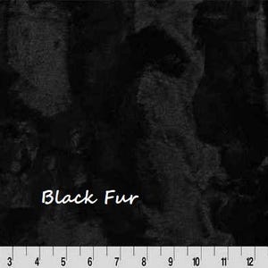 May include: Black fur fabric with a textured appearance. The words "Black Fur" are written in white script. A ruler is at the bottom of the image, with measurements in inches.