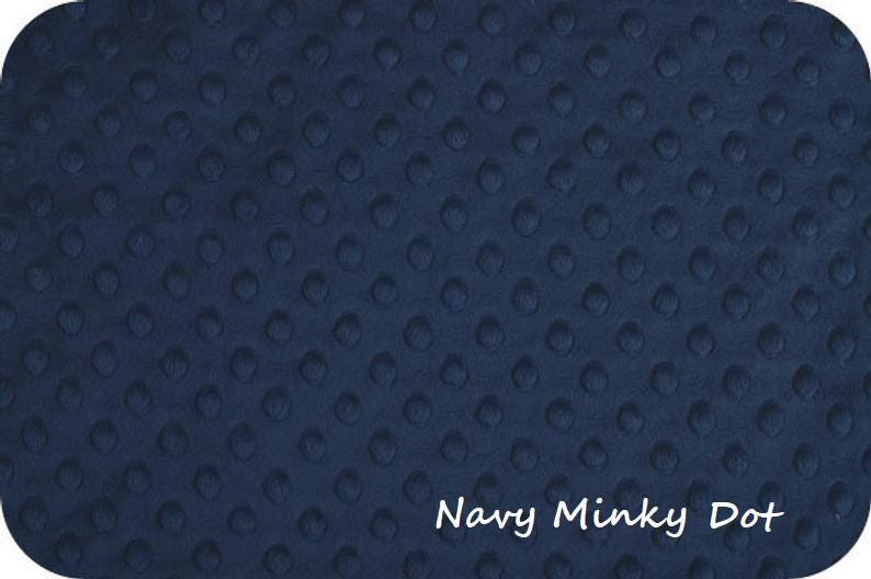 May include: Navy blue minky dot fabric with a soft, textured surface. The fabric has a rounded corner shape and the words "Navy Minky Dot" in white script.